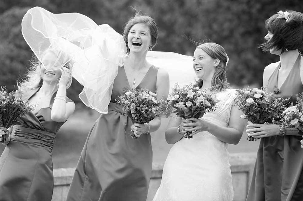 bridesmaid with bride laughter
